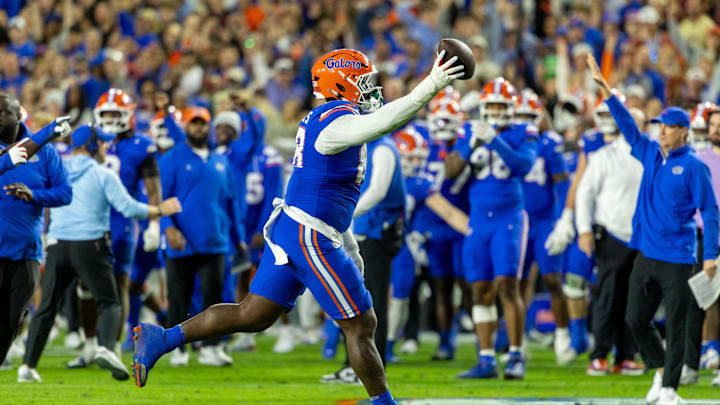 Nov 29, 2025; Gainesville, Florida, USA; Florida Gators defensive tackle Caleb Banks (88) celebrates recovering a fumble during the second quarter against the Florida State Seminoles at Ben Hill Griffin Stadium. Mandatory Credit: Bob Kupbens-Imagn Images Nov 29, 2025; Gainesville, Florida, USA; Florida Gators defensive tackle Caleb Banks (88) celebrates recovering a fumble during the second quarter against the Florida State Seminoles at Ben Hill Griffin Stadium. Mandatory Credit: Bob Kupbens-Imagn Images