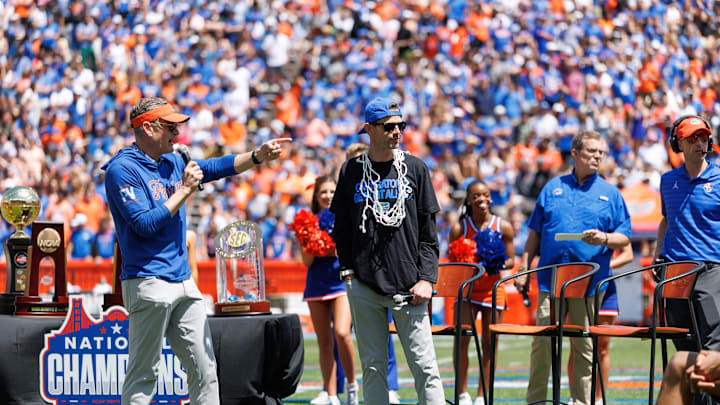 Apr 12, 2025; Gainesville, FL, USA; Florida Gators athletic director Scott Stricklin and Florida Gators head coach Todd Golden gesture during the National Championship celebration at Ben Hill Griffin Stadium. Mandatory Credit: Matt Pendleton-Imagn Images Apr 12, 2025; Gainesville, FL, USA; Florida Gators athletic director Scott Stricklin and Florida Gators head coach Todd Golden gesture during the National Championship celebration at Ben Hill Griffin Stadium. Mandatory Credit: Matt Pendleton-Imagn Images
