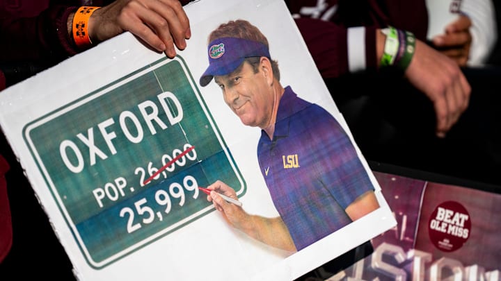 Mississippi State fans hold signs referencing Ole Miss head coach Lane Kiffin’s potential departure during a college football game between Mississippi State and Ole Miss at Davis Wade Stadium in Starkville, Miss., on Friday, Nov. 28, 2025. Ole Miss defeated Mississippi State 38-19 in the Egg Bowl.