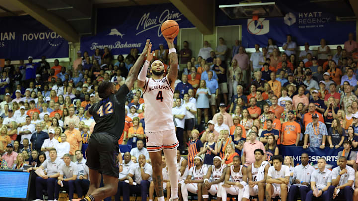 Nov 27, 2024; Lahaina, Hawaii, USA;  Auburn Tigers forward Johni Broome (4) shoots over Memphis Tigers forward Dain Dainja (42) in the second half in Lahaina Civic Center. Mandatory Credit: Marco Garcia-Imagn Images