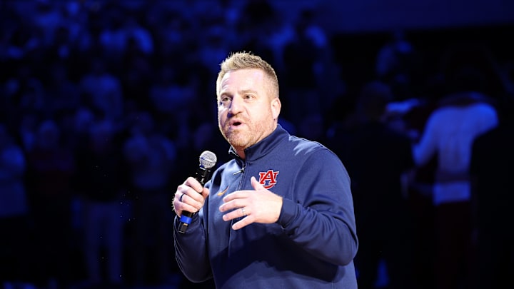 Dec 3, 2025; Auburn, Alabama, USA; Auburn Tigers head football coach Alex Golesh is introduced during the first half of a basketball game between the Auburn Tigers and NC State Wolfpack at Neville Arena. Mandatory Credit: John Reed-Imagn Images