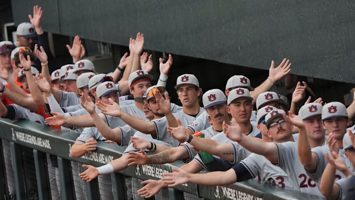 March 27, 2026; Tuscaloosa, AL, USA; Auburn players clap in unison in the dugout at Sewell-Thomas Stadium as the Crimson Tide and Auburn Tigers played the first game of their three-game series.