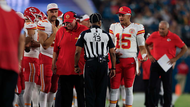 Kansas City Chiefs quarterback Patrick Mahomes (15) talks with down judge Patrick Turner (13) as head coach Andy Reid and tight end Travis Kelce (87) are on the sideline during the second quarter of a preseason NFL football game Saturday, Aug. 10, 2024 at EverBank Stadium in Jacksonville, Fla. [Corey Perrine/Florida Times-Union]