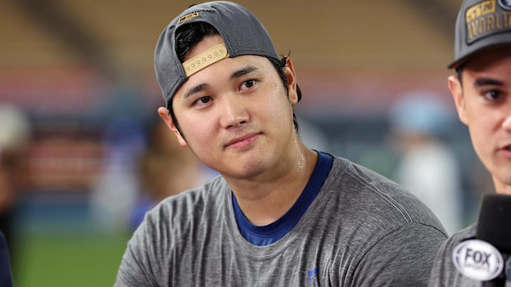 Oct 20, 2024; Los Angeles, California, USA; Los Angeles Dodgers designated hitter Shohei Ohtani (17) looks on in an interview after the Los Angeles Dodgers defeated the New York Mets in game six of the NLCS to advance to the World Series in the 2024 MLB playoffs at Dodger Stadium. Mandatory Credit: Kiyoshi Mio-Imagn Images