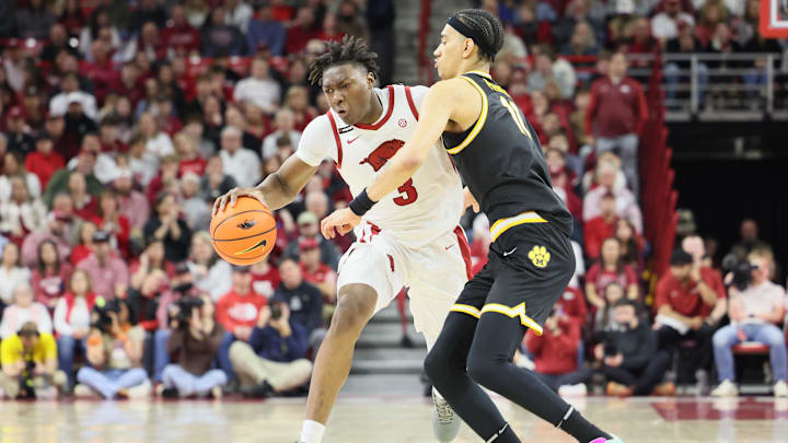 Feb 22, 2025; Fayetteville, Arkansas, USA; Arkansas Razorbacks forward Adou Thiero (3) drives against Missouri Tigers guard Trent Pierce (11) during the first half at Bud Walton Arena. Mandatory Credit: Nelson Chenault-Imagn Images