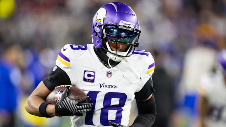 Jan 13, 2025; Glendale, AZ, USA; Minnesota Vikings wide receiver Justin Jefferson (18) against the Los Angeles Rams during an NFC wild card game at State Farm Stadium. Mandatory Credit: Mark J. Rebilas-Imagn Images