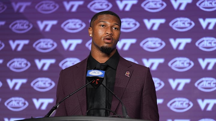 Jul 23, 2024; Charlotte, NC, USA; Virginia Tech quarterback Kyron Drones answers questions from the media during the ACC Kickoff at Hilton Charlotte Uptown. Mandatory Credit: Jim Dedmon-USA TODAY Sports