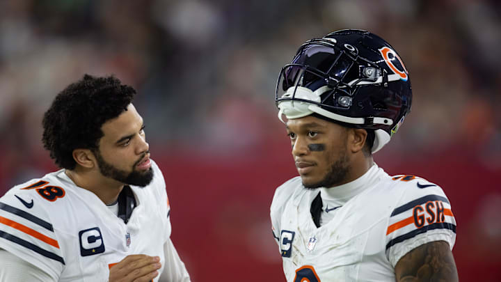 Nov 3, 2024; Glendale, Arizona, USA; Chicago Bears quarterback Caleb Williams (18) talks with wide receiver DJ Moore (2) against the Arizona Cardinals at State Farm Stadium. Mandatory Credit: Mark J. Rebilas-Imagn Images