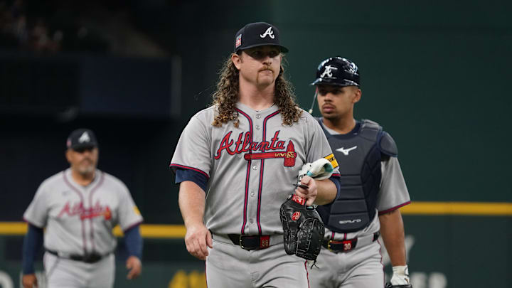 Jul 26, 2025; Arlington, Texas, USA; Atlanta Braves starting pitcher Grant Holmes (66) walks in from the bullpen prior to a game against the Texas Rangers at Globe Life Field. Mandatory Credit: Raymond Carlin III-Imagn Images