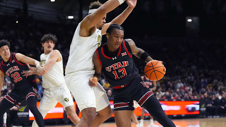 Jan 7, 2026; Boulder, Colorado, USA; Colorado Buffaloes center Elijah Malone (50) defends against Utah Utes forward Kendyl Sanders (13) in the first that at CU Events Center. Mandatory Credit: Ron Chenoy-Imagn Images