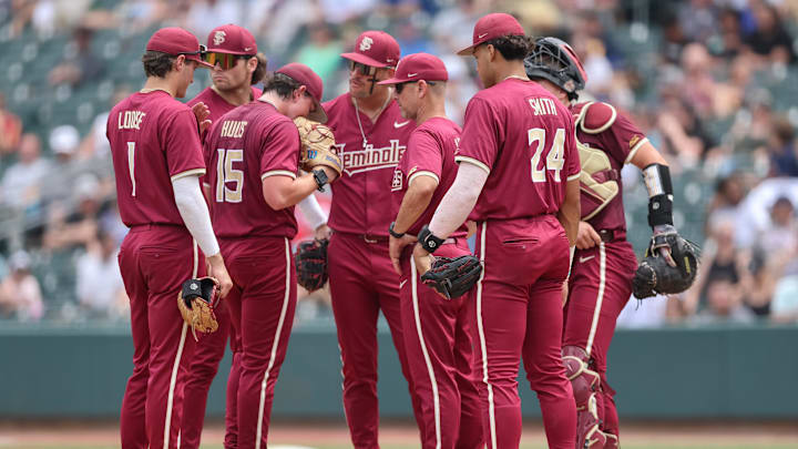 May 25, 2024; Charlotte, NC, USA; Florida State head coach Link Jarrett relieves Florida State pitcher Connor Hults (15) in the sixth inning against Wake Forest during the ACC Baseball Tournament at Truist Field. Mandatory Credit: Cory Knowlton-USA TODAY Sports
