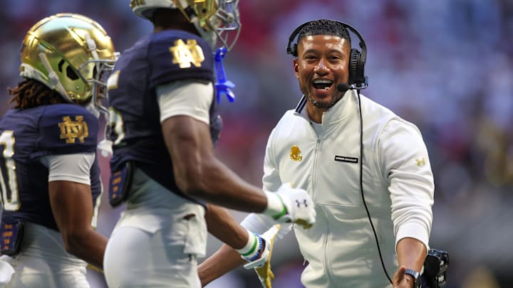 Oct 19, 2024; Atlanta, Georgia, USA; Notre Dame Fighting Irish head coach Marcus Freeman celebrates after a touchdown against the Georgia Tech Yellow Jackets in the third quarter at Mercedes-Benz Stadium. Mandatory Credit: Brett Davis-Imagn Images