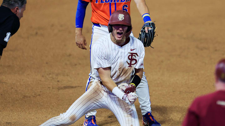 Florida St. infielder Alex Lodise (1) reacts to his triple at third base against Florida utility Bobby Boser (6) during the seventh inning of an NCAA college baseball matchup Tuesday, March 25, 2025 at VyStar Ballpark in Jacksonville, Fla. FSU rallied to defeat UF 8-4 off a walk-off grand slam from Alex Lodise in the ninth inning. [Corey Perrine/Florida Times-Union]