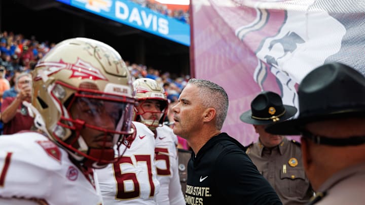 Nov 29, 2025; Gainesville, Florida, USA; Florida State Seminoles head coach Mike Norvell waits to run on the field before a game against the Florida Gators at Ben Hill Griffin Stadium. Mandatory Credit: Matt Pendleton-Imagn Images