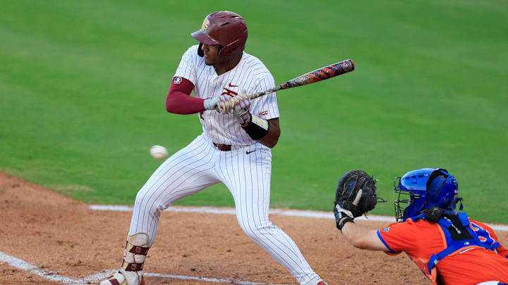 Florida St. infielder Myles Bailey (12) eyes a pitch during the fourth inning of an NCAA college baseball matchup Tuesday, March 25, 2025 at VyStar Ballpark in Jacksonville, Fla. FSU rallied to defeat UF 8-4 off a walk-off grand slam from Alex Lodise in the ninth inning. [Corey Perrine/Florida Times-Union]