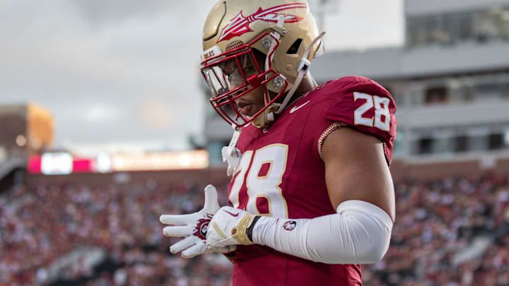 Florida State linebacker Justin Cryer (28) warming up before the rivalry match between No. 18 Florida State University and No. 3 University of Miami. Florida State linebacker Justin Cryer (28) warming up before the rivalry match between No. 18 Florida State University and No. 3 University of Miami.