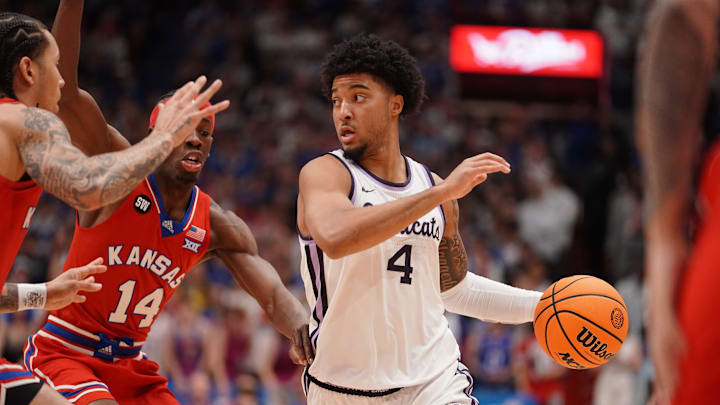 Kansas State Wildcats guard PJ Haggerty (4) drives the ball against Kansas Jayhawks during the Sunflower Showdown game inside Allen Fieldhouse in Lawrence, Kansas, on Saturday, March 7, 2026.