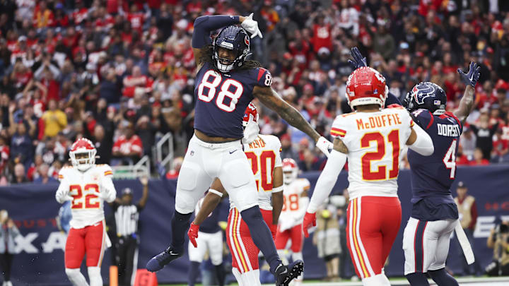 Dec 18, 2022; Houston, Texas, USA; Houston Texans tight end Jordan Akins (88) celebrates after scoring a touchdown   during the third quarter against the Kansas City Chiefs during the third quarter at NRG Stadium. Mandatory Credit: Kevin Jairaj-Imagn Images