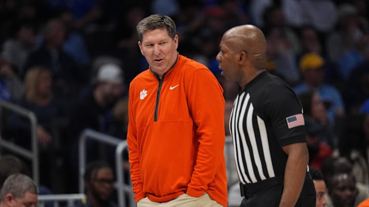 Mar 13, 2026; Charlotte, NC, USA; Clemson Tigers head coach Brad Brownell talks with the official during the first half against the Clemson Tigers at Spectrum Center. Mandatory Credit: Jim Dedmon-Imagn Images