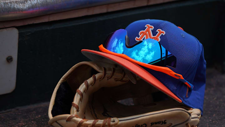 Mar 24, 2018; Jupiter, FL, USA; A New York Mets hat with sunglasses sits on a glove in the dugout during a spring training game between the St. Louis Cardinals and the New York Mets at Roger Dean Stadium. Mandatory Credit: Jasen Vinlove-Imagn Images Mar 24, 2018; Jupiter, FL, USA; A New York Mets hat with sunglasses sits on a glove in the dugout during a spring training game between the St. Louis Cardinals and the New York Mets at Roger Dean Stadium. Mandatory Credit: Jasen Vinlove-Imagn Images