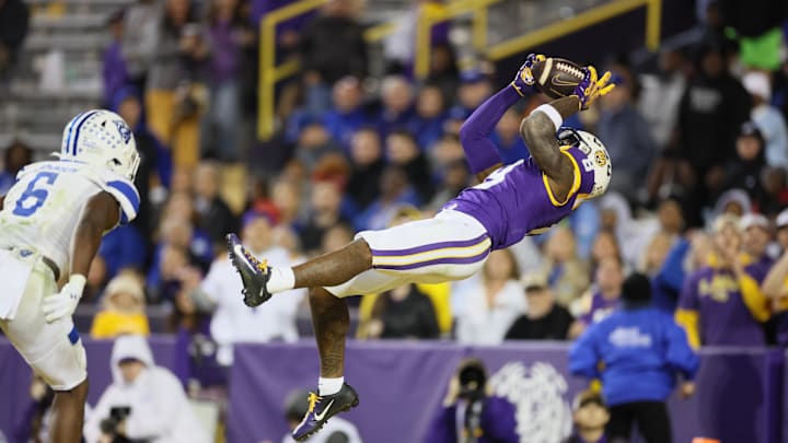 Nov 18, 2023; Baton Rouge, Louisiana, USA; LSU Tigers wide receiver Malik Nabers (8) hauls in a
