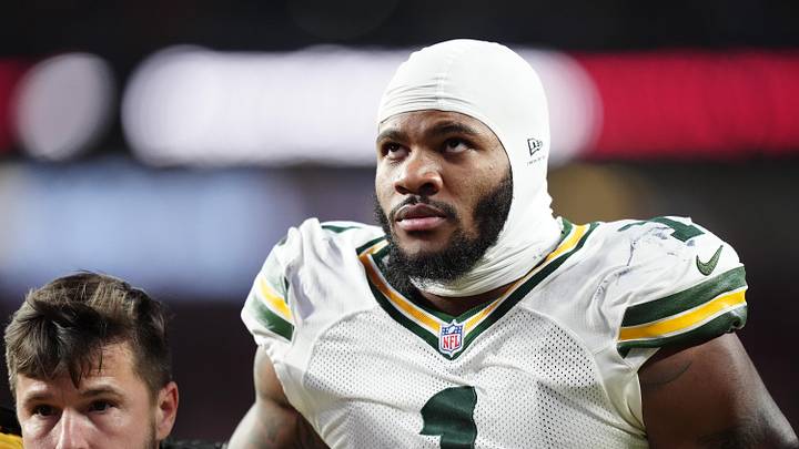 Dec 14, 2025; Denver, Colorado, USA; Green Bay Packers defensive end Micah Parsons (1) walks off the field with help from medical personnel following an injury during the third quarter against the Denver Broncos at Empower Field at Mile High. Mandatory Credit: Ron Chenoy-Imagn Images