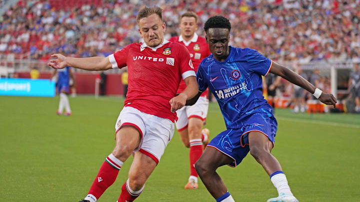 Jul 24, 2024; Santa Clara, CA, USA; Chelsea forward Tyrique George (32) dribbles against Wrexham midfielder Luke Bolton (17) in the first half at Levi's Stadium. Mandatory Credit: David Gonzales-Imagn Images