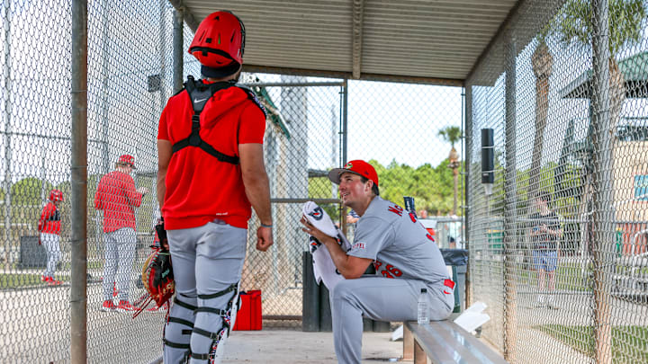 Feb 14, 2026; Jupiter, FL, USA; St. Louis Cardinals pitcher Michael McGreevy (36) speaks to catcher Ivan Herrera (48) inside a dugout during spring training at Roger Dean Chevrolet Stadium. Mandatory Credit: Sam Navarro-Imagn Images