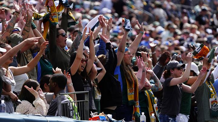 Mar 28, 2026; Denver, Colorado, USA; Denver Summit FC fans cheer during the match against the Washington Spirit at Empower Field at Mile High. Mandatory Credit: Ron Chenoy-Imagn Images