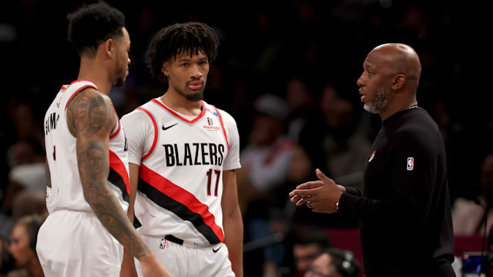 Feb 28, 2025; Brooklyn, New York, USA; Portland Trail Blazers head coach Chauncey Billups talks to guards Anfernee Simons (1) and Shaedon Sharpe (17) during the first quarter against the Brooklyn Nets at Barclays Center. Mandatory Credit: Brad Penner-Imagn Images