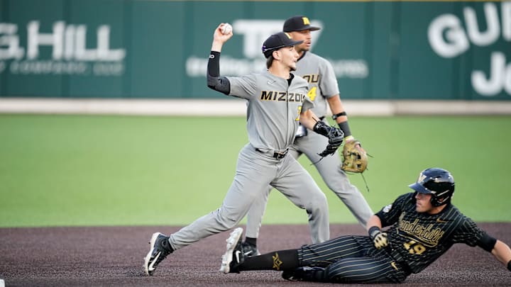 Missouri shortstop Drew Culbertson (7) focues out Vanderbilt left fielder Troy LaNeve (19) on a