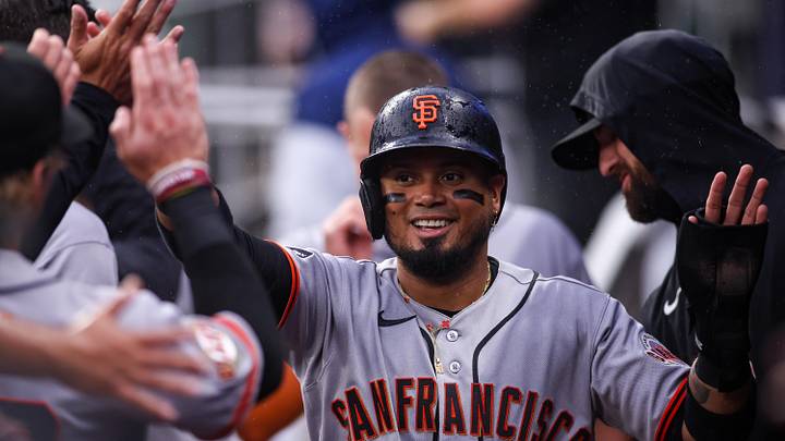 Atlanta, Georgia, USA; San Francisco Giants second baseman Luis Arraez (1) celebrates with teammates after scoring a run against the Atlanta Braves in the first inning at Truist Park. Mandatory Credit: Brett Davis-Imagn Images