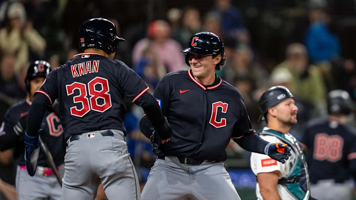 Mar 28, 2026; Seattle, Washington, USA; Cleveland Guardians designated hitter Chase DeLauter (24) celegbrates with centerfielder Steven Kwan (38) after hitting a two-run home run during the tenth inning against the Seattle Mariners at T-Mobile Park. Mandatory Credit: Stephen Brashear-Imagn Images
