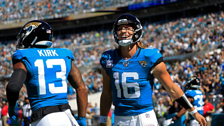 Jacksonville Jaguars quarterback Trevor Lawrence (16) celebrates his pass for a touchdown score to
