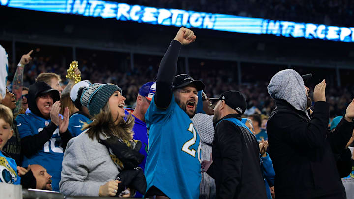 Jacksonville Jaguars fans cheer during an interception during an NFL football regular season matchup AFC South division title game Saturday, Jan. 7, 2023 at TIAA Bank Field in Jacksonville. 
