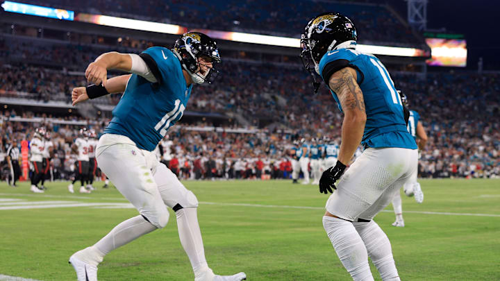 Jacksonville Jaguars quarterback Mac Jones (10), left, celebrates the touchdown pass he threw to wide receiver Parker Washington (11) during the second quarter of a preseason NFL football game Saturday, Aug. 17, 2024 at EverBank Stadium in Jacksonville, Fla. [Corey Perrine/Florida Times-Union]