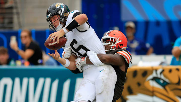 Cleveland Browns defensive end Alex Wright (91) sacks Jacksonville Jaguars quarterback Trevor Lawrence (16) in the end zone for a safety during the fourth quarter of an NFL football matchup Sunday, Sept. 15, 2024 at EverBank Stadium in Jacksonville, Fla. The Browns defeated the Jaguars 18-13. 