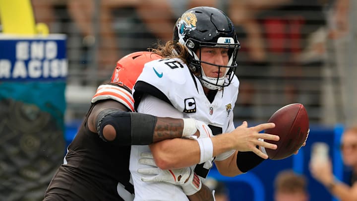 Cleveland Browns defensive end Alex Wright (91) sacks Jacksonville Jaguars quarterback Trevor Lawrence (16) in the end zone for a safety during the fourth quarter of an NFL football matchup Sunday, Sept. 15, 2024 at EverBank Stadium in Jacksonville, Fla. The Browns defeated the Jaguars 18-13. 