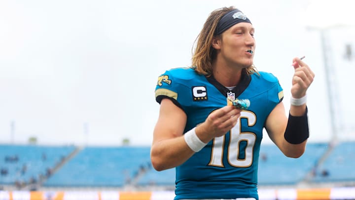 Jacksonville Jaguars quarterback Trevor Lawrence (16) is given cake to eat, during an interview on his 25th birthday, after an NFL football matchup Sunday, Oct. 6, 2024 at EverBank Stadium in Jacksonville, Fla. The Jaguars edged the Colts on a field goal 37-34. 