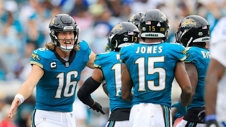 Jacksonville Jaguars quarterback Trevor Lawrence (16) congratulates wide receiver Christian Kirk (13) for a reception during the fourth quarter of an NFL football matchup Sunday, Oct. 6, 2024 at EverBank Stadium in Jacksonville, Fla. The Jaguars edged the Colts on a field goal 37-34.