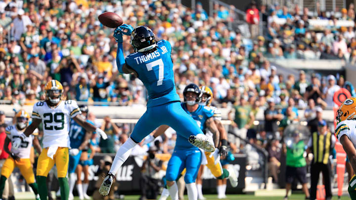 Jacksonville Jaguars wide receiver Brian Thomas Jr. (7) corrals the ball for a touchdown score during the third quarter of an NFL football matchup Sunday, Oct. 27, 2024 at EverBank Stadium in Jacksonville, Fla. The Packers edged the Jaguars 30-27 on a last-second field goal. 