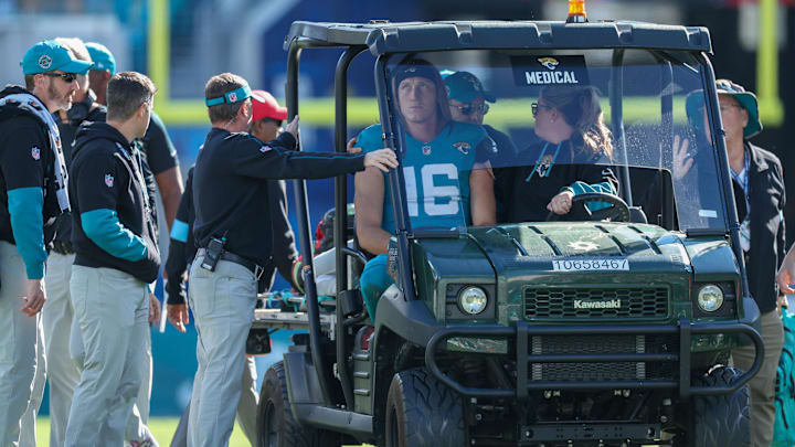 Dec 1, 2024; Jacksonville, Florida, USA; Jacksonville Jaguars quarterback Trevor Lawrence (16) is carted off the field against the Houston Texans in the second quarter at EverBank Stadium. 