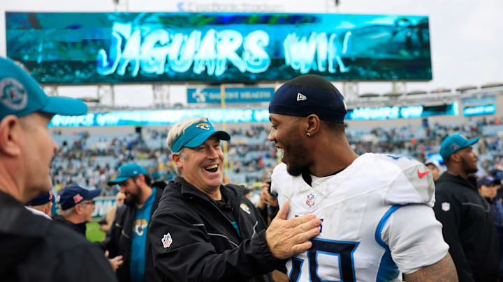 Jacksonville Jaguars head coach Doug Pederson greets Tennessee Titans linebacker Arden Key (49) after the game Sunday, Dec. 29, 2024 at EverBank Stadium in Jacksonville, Fla. The Jaguars held off the Titans 20-13. 