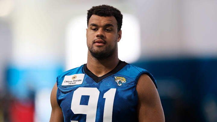 Jacksonville Jaguars defensive lineman Arik Armstead (91) walks to be interviewed after a combined NFL football training camp session between the Tampa Bay Buccaneers and Jacksonville Jaguars Wednesday, Aug. 14, 2024 at EverBank Stadium’s Miller Electric Center in Jacksonville, Fla.