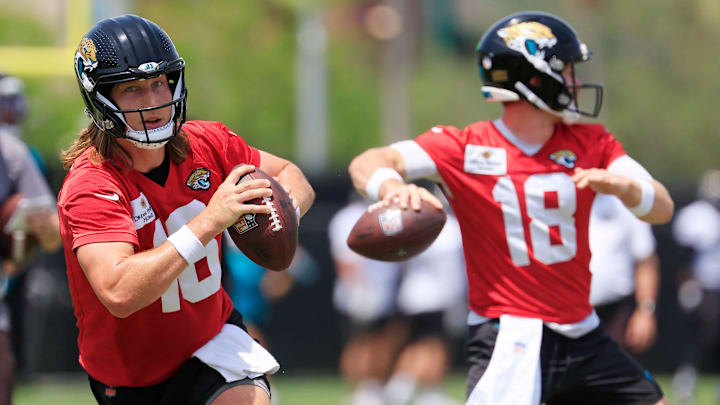Jacksonville Jaguars quarterback Trevor Lawrence (16) looks to throw next to quarterback John Wolford (18) during the first organized team activity at Miller Electric Center Monday, May 19, 2025 in Jacksonville, Fla.