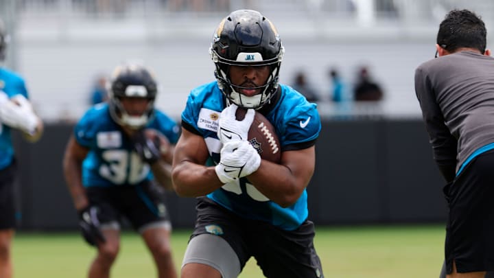 Jacksonville Jaguars running back Bhayshul Tuten (33) runs the ball during a rookie minicamp at Miller Electric Center Saturday, May 10, 2025 in Jacksonville, Fla. [Corey Perrine/Florida Times-Union]