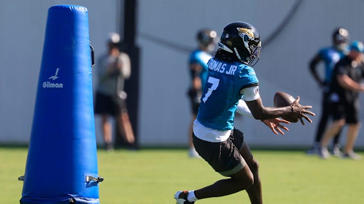 Jacksonville Jaguars wide receiver Brian Thomas Jr. (7) bobbles a pass during the second mandatory minicamp at Miller Electric Center Wednesday, June 11, 2025 in Jacksonville, Fla.
