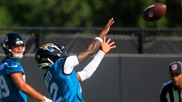 Jacksonville Jaguars wide receiver Travis Hunter (12) catches a pass as wide receiver Louis Rees-Zammit (89) looks on during the second mandatory minicamp at Miller Electric Center Wednesday, June 11, 2025 in Jacksonville, Fla.