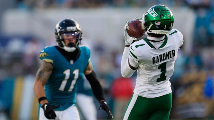 New York Jets cornerback Sauce Gardner (1) hauls in an interception against Jacksonville Jaguars wide receiver Parker Washington (11) during the fourth quarter Sunday, Dec. 15, 2024 at EverBank Stadium in Jacksonville, Fla. The Jets held off the Jaguars 32-25. 