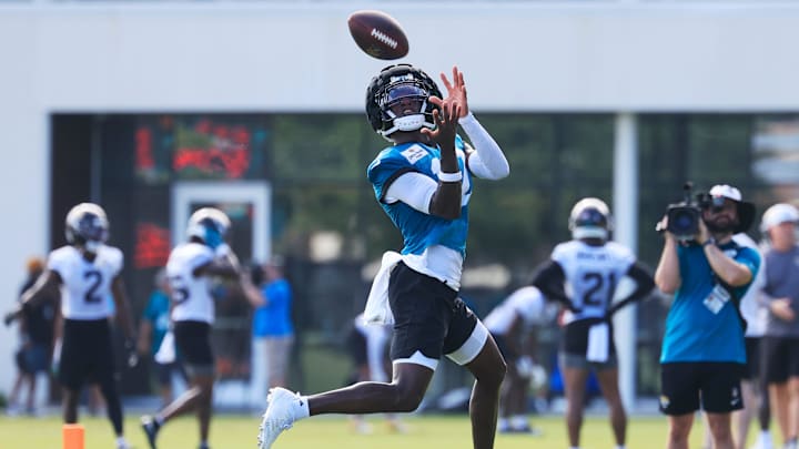 Jacksonville Jaguars wide receiver Travis Hunter (12) catches a pass during an NFL training camp session at the Miller Electric Center, Sunday, Aug. 3, 2025, in Jacksonville, Fla. [Corey Perrine/Florida Times-Union]
